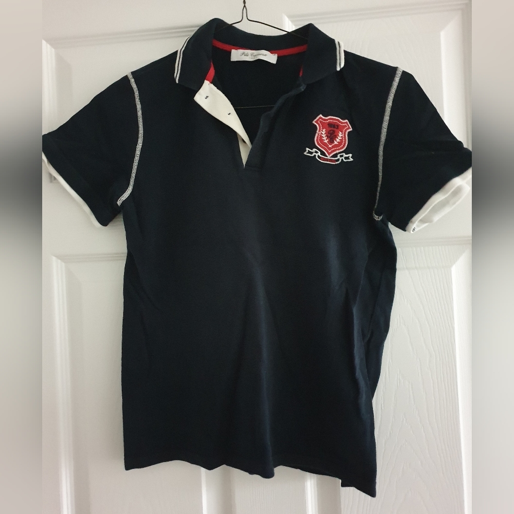 Pili Carrera, navy blue polo, size 12/14
